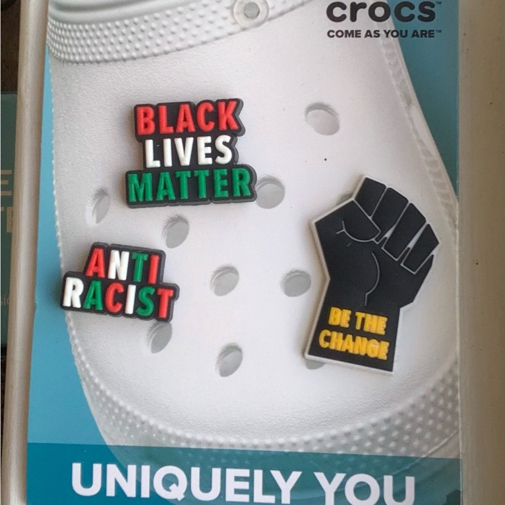 White Crocs with Activist Jibbitz
